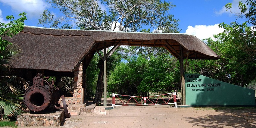Mtemere gate of Selous National Park Tanzania with unique architecture and signage on the wall.
